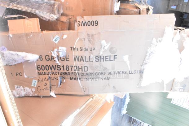 Cardboard box labeled "16 Gauge Wall Shelf," model 600WS1872HD, manufactured for Clark Core Services, made in Vietnam. Box is dented.