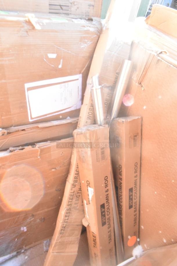 Assorted scratch and dent boxes containing new sink, bar stool, table base plate, and pot rack. Sale includes 12 items.