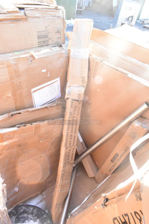 Boxes of 12 new scratch-and-dent items including a sink, bar stool, table base plate, and pot rack. Labels show dimensions.