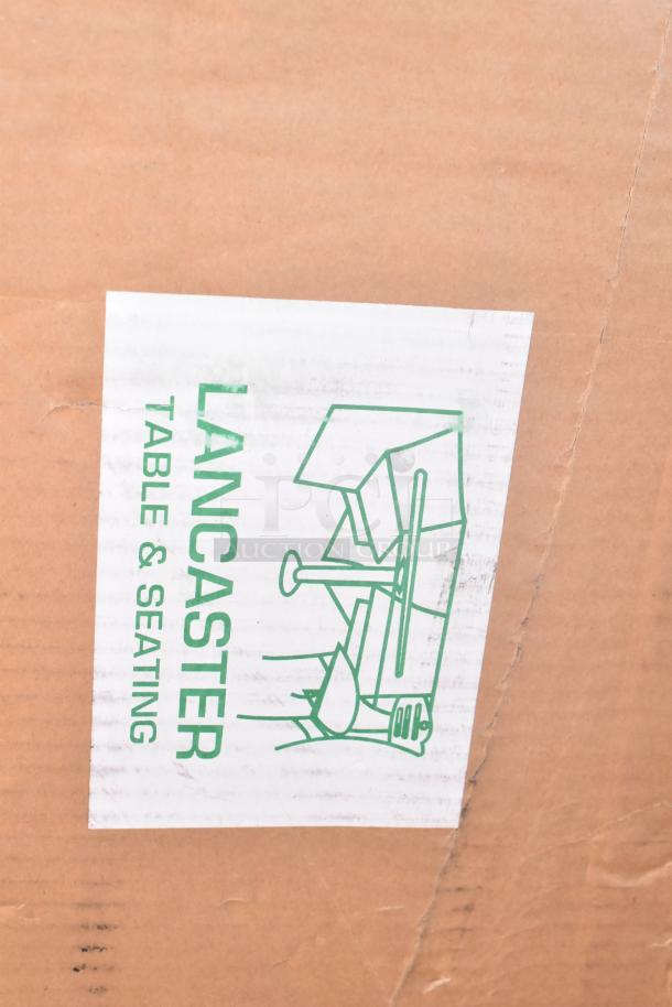 Box with "Lancaster Table & Seating" label, containing 12 scratch and dent items: sink, bar stool, table base, pot rack.