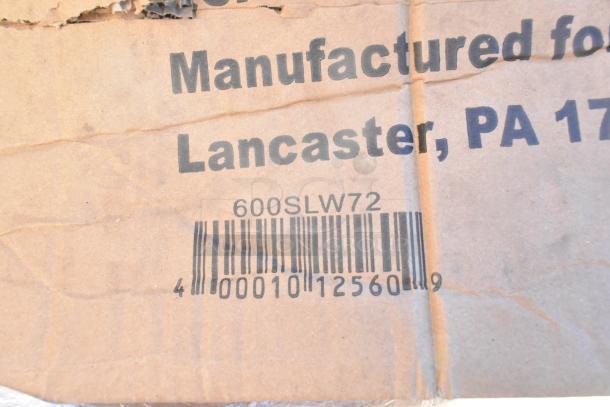 Cardboard packaging for new scratch and dent items featuring a barcode and text indicating manufacturing in Lancaster, PA.