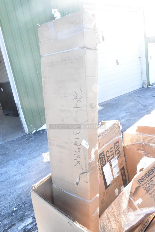 Cardboard boxes containing 12 new scratch and dent items, including a sink, bar stool, table base plate, and pot rack. Markings indicate "24 131275 KK" and shipping labels are visible.