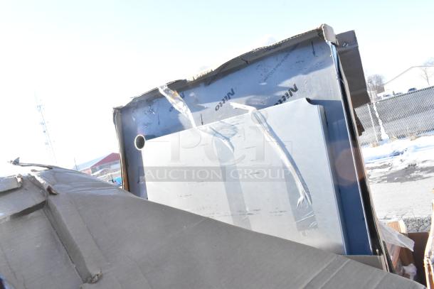 Seven scratch and dent items including a Bakers Lane ingredient bin, Regency table, and pan racks in packaging.