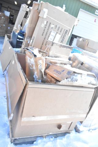 Boxes of 10 scratch and dent items, including shelves and baby changing station. Boxes show wear and snow exposure.