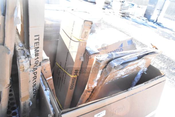 Cardboard boxes containing 10 brand new scratch and dent items, including shelves and a baby changing station.