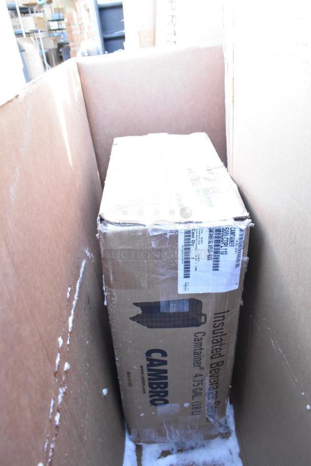 Cardboard box with a Cambro Camtainer label, 4.75 gallons, visible in shipping condition. Tags indicate model and details.