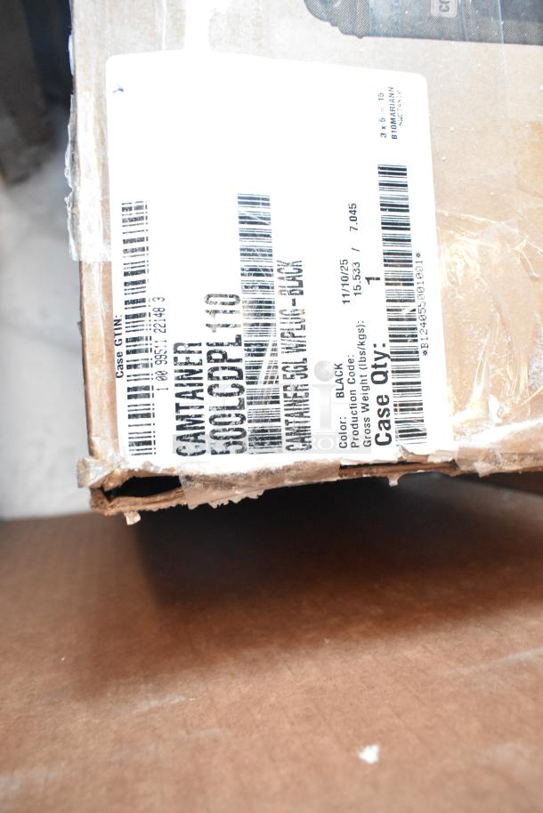 Damaged cardboard box with a label showing production code, color black, and weight details. Box corner is worn.