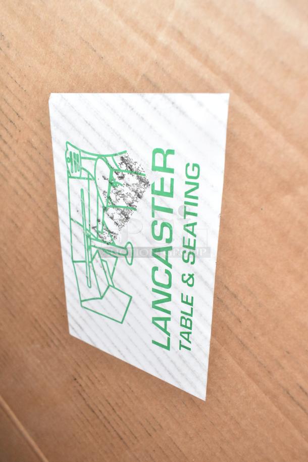Cardboard box with "LANCASTER TABLE & SEATING" label. Contains 10 new scratch and dent items, including shelves and a baby changing station.