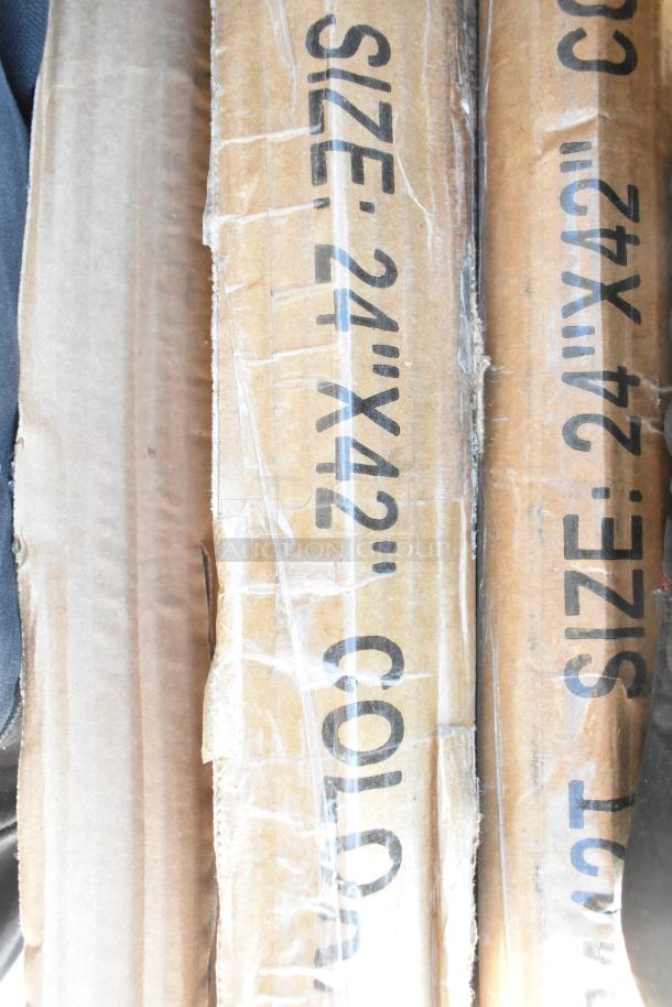 Cardboard boxes with printed "SIZE: 24''X42'" text, part of a lot of 10 new, scratch and dent items including shelves.