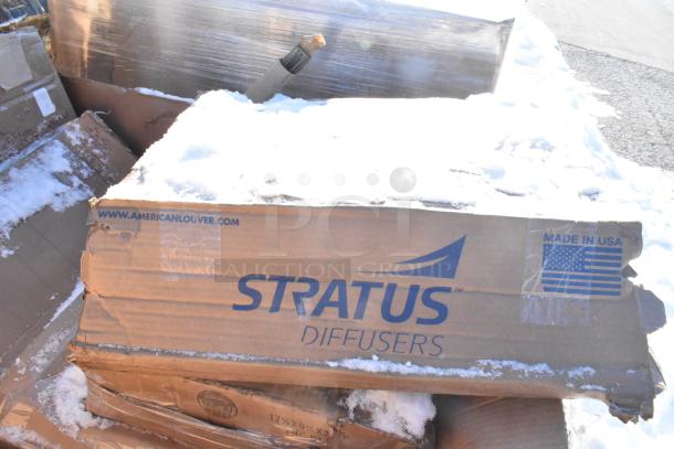 Cardboard box labeled "Stratus Diffusers," showing damage and snow, marked "Made in USA" and featuring a URL.