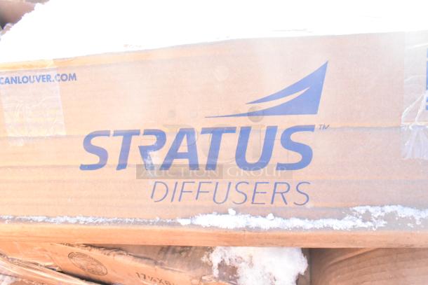 Cardboard box labeled "STRATUS Diffusers," some snow on top, part of a lot with shelves and a baby changing station.