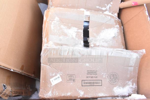 Cardboard boxes with visible scratches and dents, containing new items including shelves and a baby changing station.