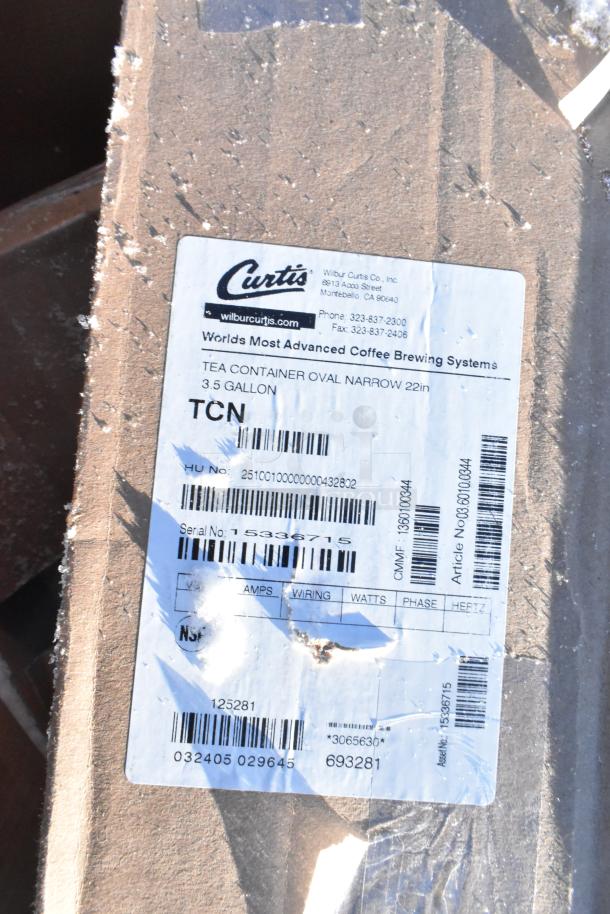 Label of Curtis tea container, 3.5-gallon, oval narrow 22in, with part details and serial number on box with visible damage.