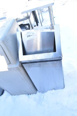 Stainless steel trash can shell with swinging flap lid, slight wear, label indicating auction item 259.