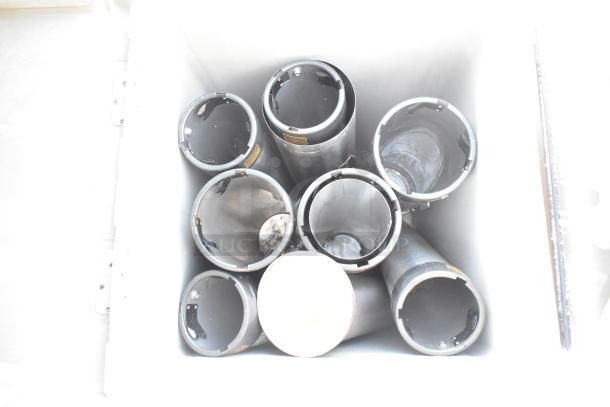 Poly trash can shell with swinging flap lid, containing multiple metal cup dispensers, visible from top view.