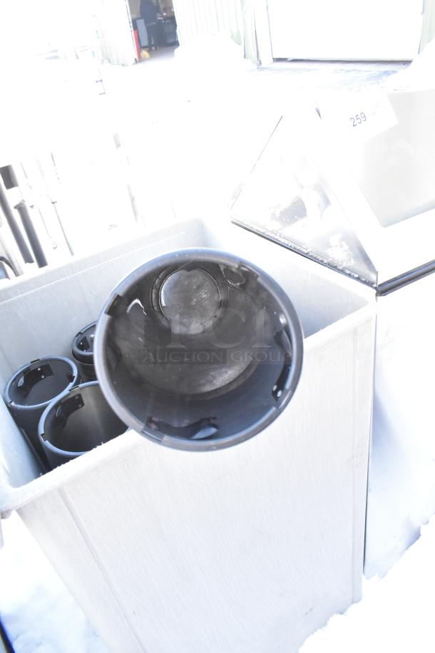 Poly trash can shell with swinging flap lid; includes cup dispensers inside. Appears in used condition.