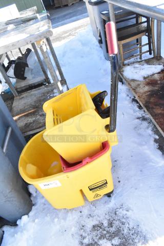 Rubbermaid yellow poly mop bucket with wringing attachment, commercial casters; slight wear, Rubbermaid WaveBrake label visible.