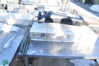 6 items including 4 white poly drawers, napkin dispenser, metal whisks. Light wear, ideal for kitchen use.