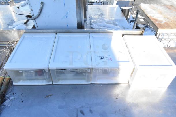 Four poly drawers with labels, one labeled "Blender Parts," alongside a napkin dispenser and several whisks. Good condition.