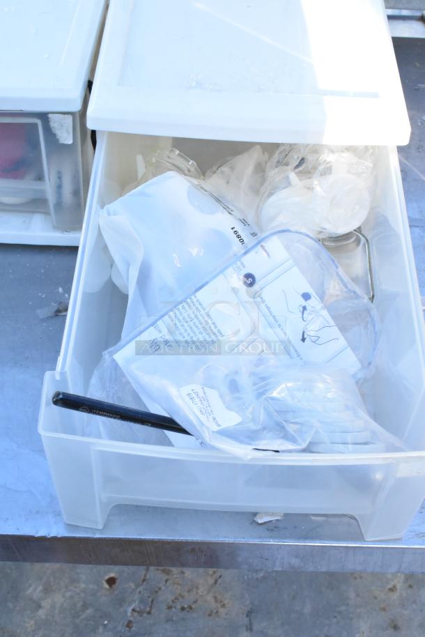 Assorted kitchen items including 4 poly drawers, a napkin dispenser, and whisks, lightly used with visible packaging.