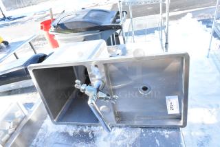 Stainless steel drop-in sink with attached chrome faucet, rectangular basin, and visible label. Appears in good condition.