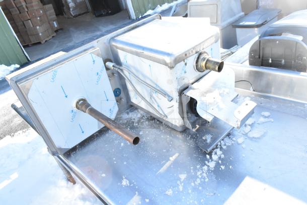 Stainless steel drop-in sink with plumbing fittings, shown in industrial setting; protective film intact, unused condition.