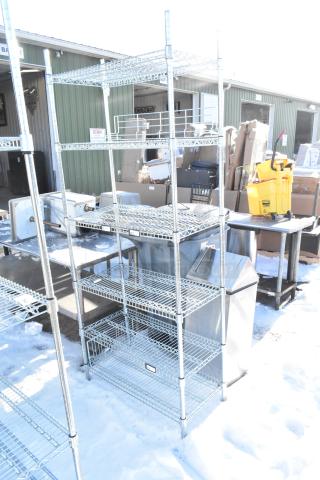 Chrome finish 6-tier wire shelving unit outdoors, in good condition. Buyer must dismantle; consider freight charges.