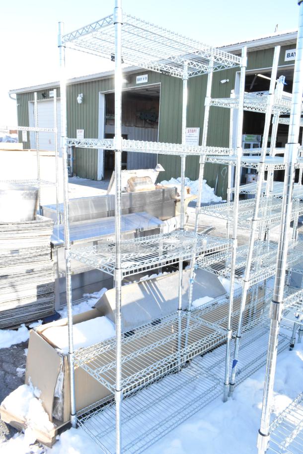 Chrome finish 5-tier wire shelving unit outdoors, requires buyer dismantling, sturdy metal construction, freight charges apply.
