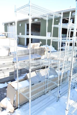 Chrome finish 5-tier wire shelving unit outdoors, requires buyer dismantling, sturdy metal construction, freight charges apply.