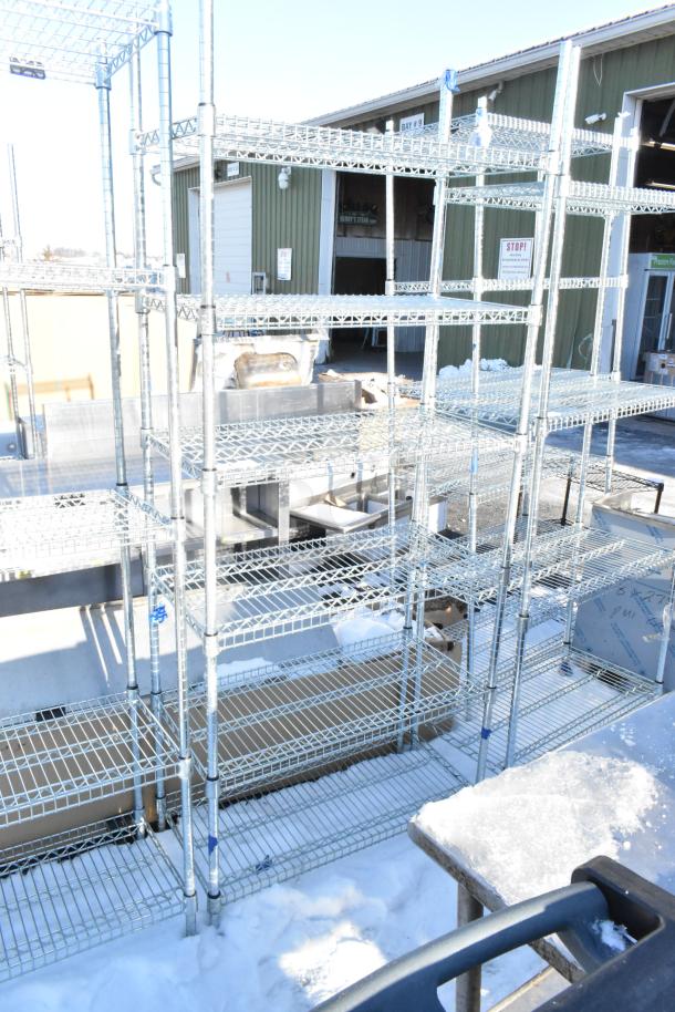 Chrome finish 6-tier wire shelving unit outdoors. Buyer must dismantle. Suitable for storage, consider freight charges.