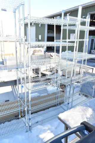 Chrome finish 6-tier wire shelving unit outdoors. Buyer must dismantle. Suitable for storage, consider freight charges.