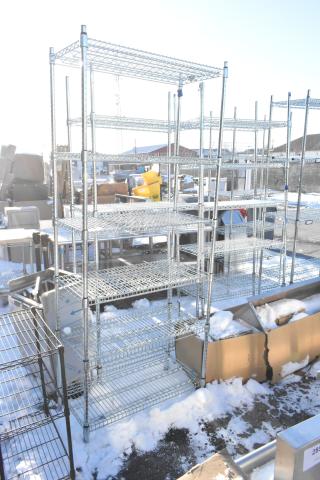 Chrome finish 6 tier wire shelving unit in outdoor setting. Buyers must dismantle. Consider freight charges.
