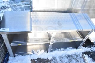 Stainless steel counter with two under shelves, used condition. Auction tag reads "282" with details.