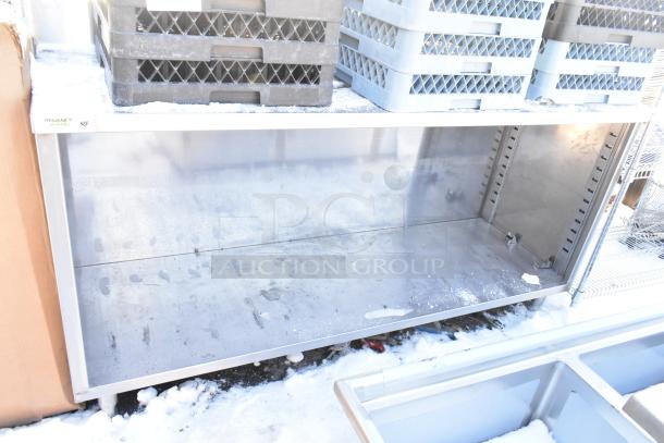 Regency 600EBTB2472 stainless steel table with open front, adjustable midshelf, and 6" backsplash. Includes dish caddies.