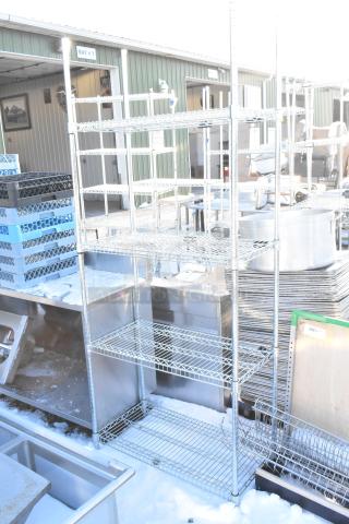 Chrome finish 4-tier wire shelving unit, sturdy construction, excellent condition. Buyer must dismantle; consider freight.