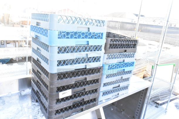 Lot of 14 poly dish caddies, stacked in blue and black, with a label indicating quantity. Used condition, outdoor setting.