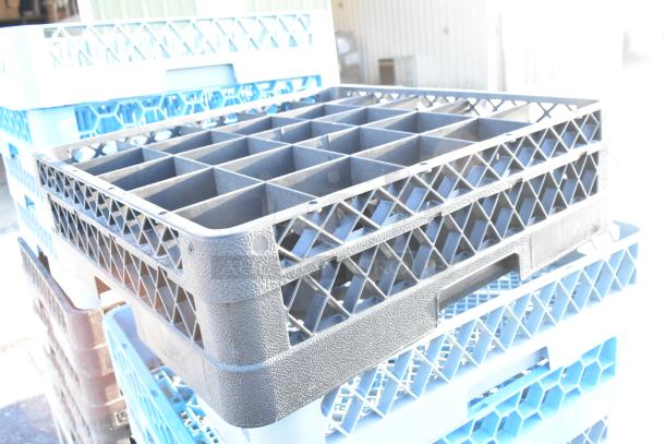 Lot of 14 poly dish caddies, stackable with grid design, visible scuff marks, used for organizing and storing dishes.