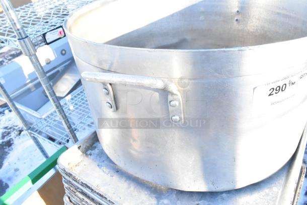 Metal stock pot and baking pans, slightly worn, from a lot of 100 various kitchen items. Includes handles and auction label.