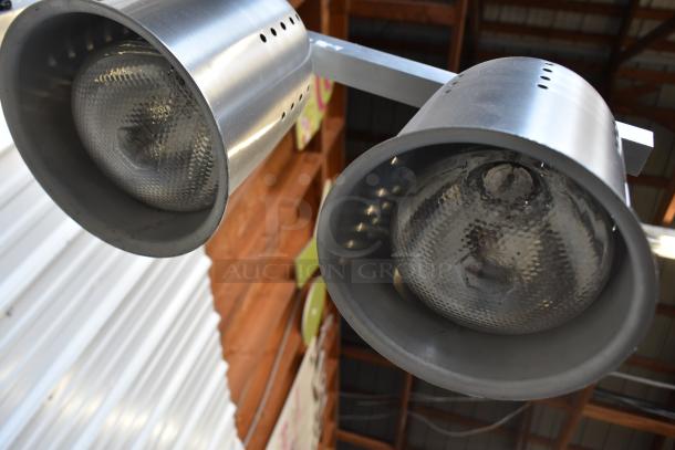 Avantco W62 countertop warming lamp with two heads, 120 volts, stainless steel, in good condition.