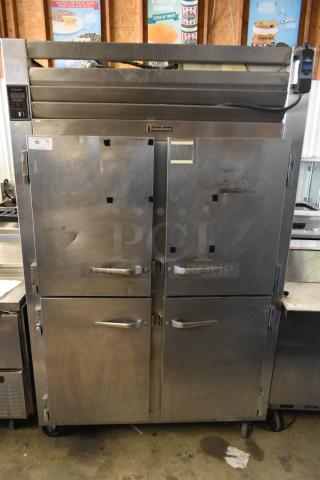 Traulsen RHT 2-32NUT stainless steel commercial 2-door cooler with casters, 115V, 1 phase, shows signs of use.