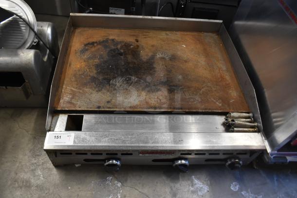 American Range commercial countertop flat top griddle with thermostatic controls, showing wear on cooking surface.