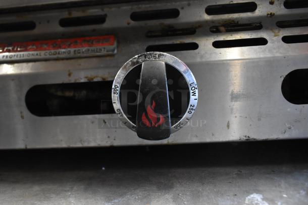 American Range commercial griddle with thermostatic controls, visible temperature dial, and branding plate. Well-used condition.