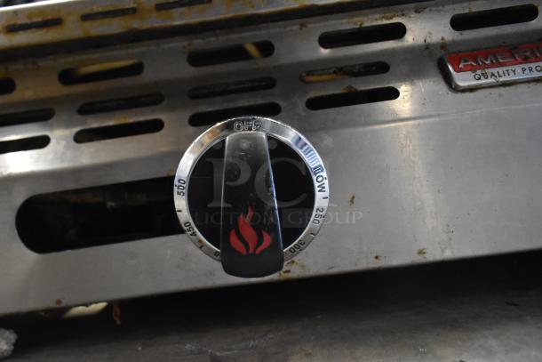 American Range commercial griddle knob with temperature markings from 250 to 500, visible wear, and flame icon.
