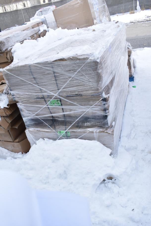 Pallet of new scratch and dent cabinets/lockers wrapped in plastic, snowy outdoor setting, auction label visible.