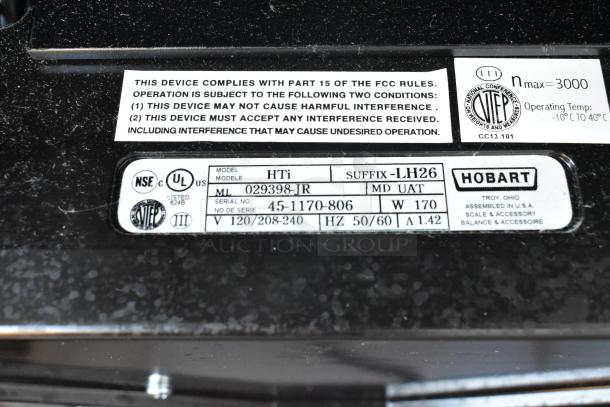 2017 Hobart HTi-7LH26 scale plate with labels showing model, serial number, voltage, and safety certifications.