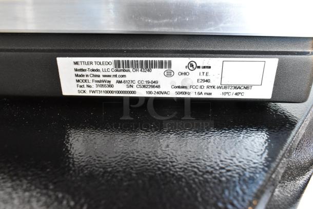 Mettler Toledo FreshWay Scale label, model AM-6127C, serial number C536226648, 100-240VAC, in original condition.
