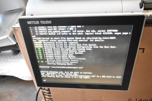 Mettler Toledo AM-5545 metal commercial countertop food portioning scale shown displaying startup diagnostics, in tested working condition.