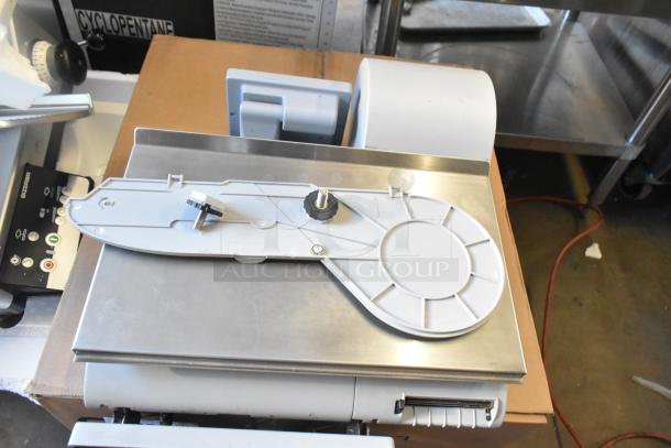 Mettler Toledo AM-5545 metal countertop food portioning scale, tested and working, 100-240V, compact design, excellent condition.