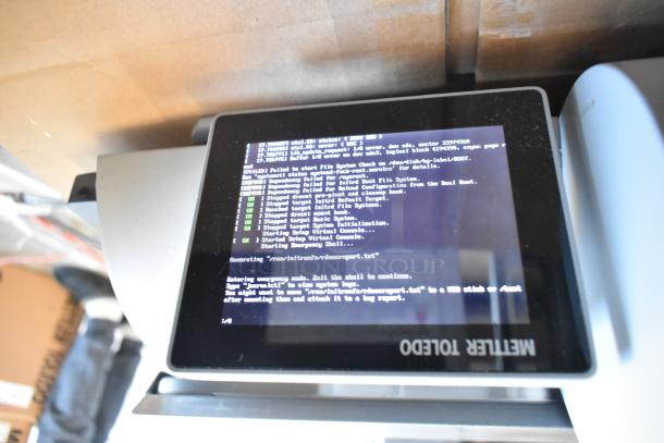 Mettler Toledo AM-5545 metal countertop food portioning scale, 100-240V, tested and working, black screen with system text.