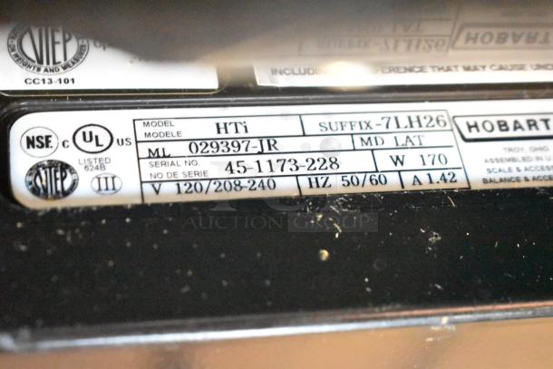 2017 Hobart HTi-7LH26 scale tag. Displays model, serial number, voltage, certification, and other specifications.